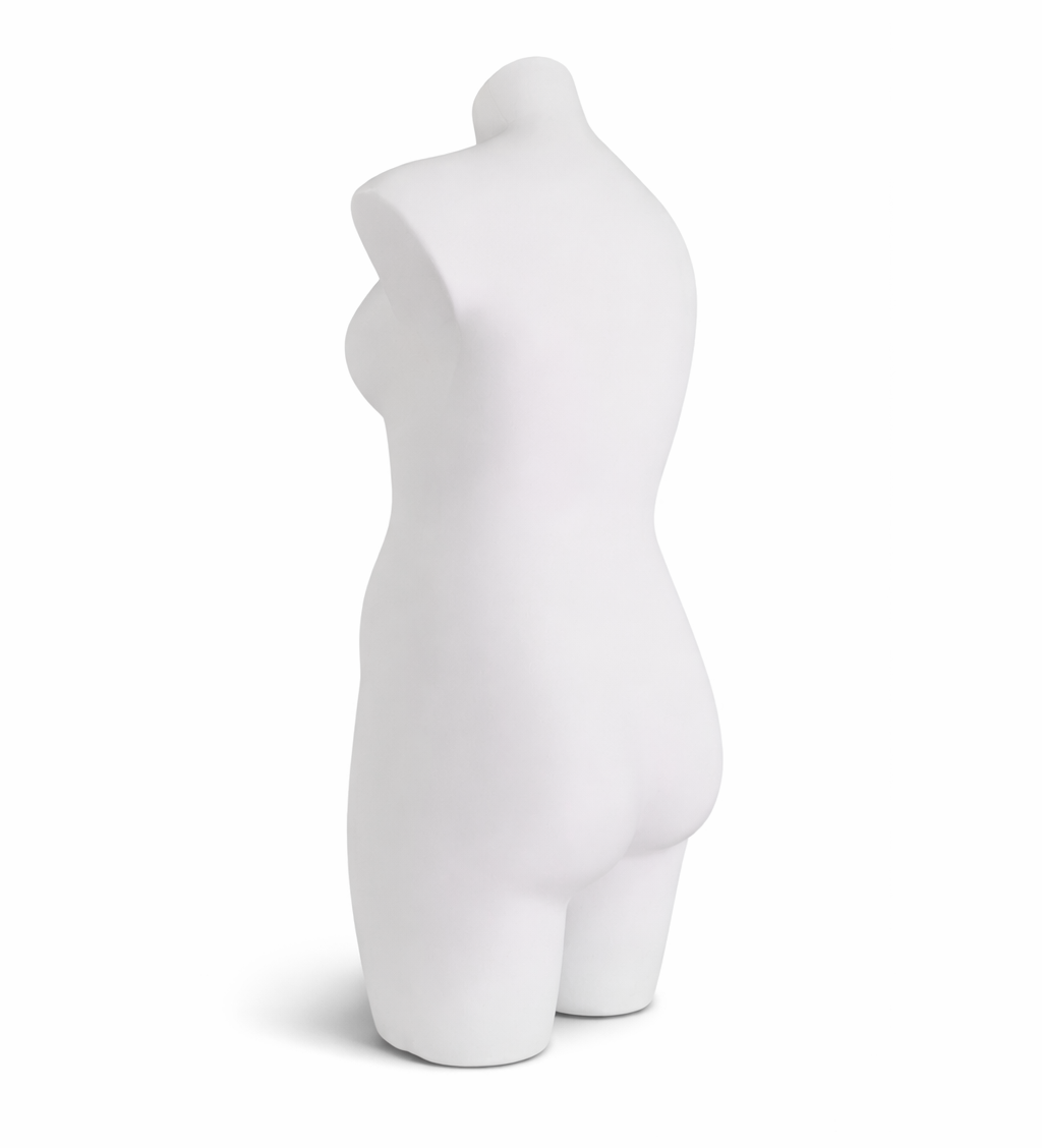 White female torso mannequin on a white background