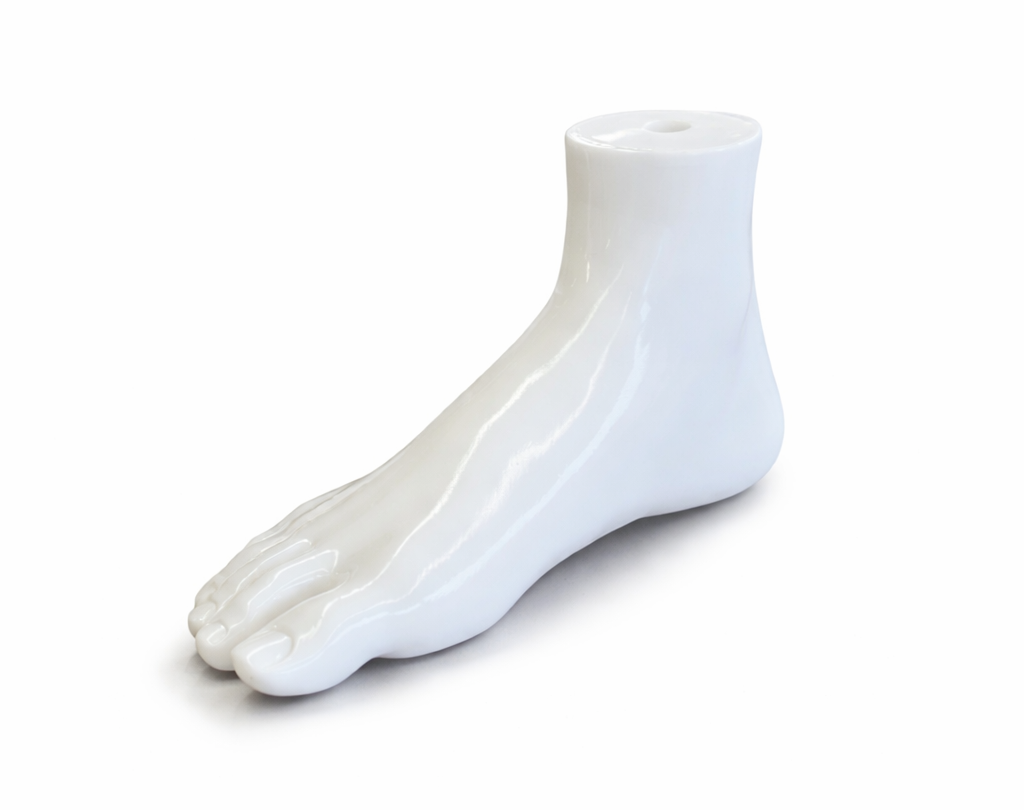 White plastic foot display on a white background