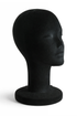 black flocked female head form on a white background