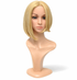 Blonde wig on a mannequin head against a white background