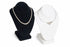 Black and white jewelry display stands with necklaces on a white background
