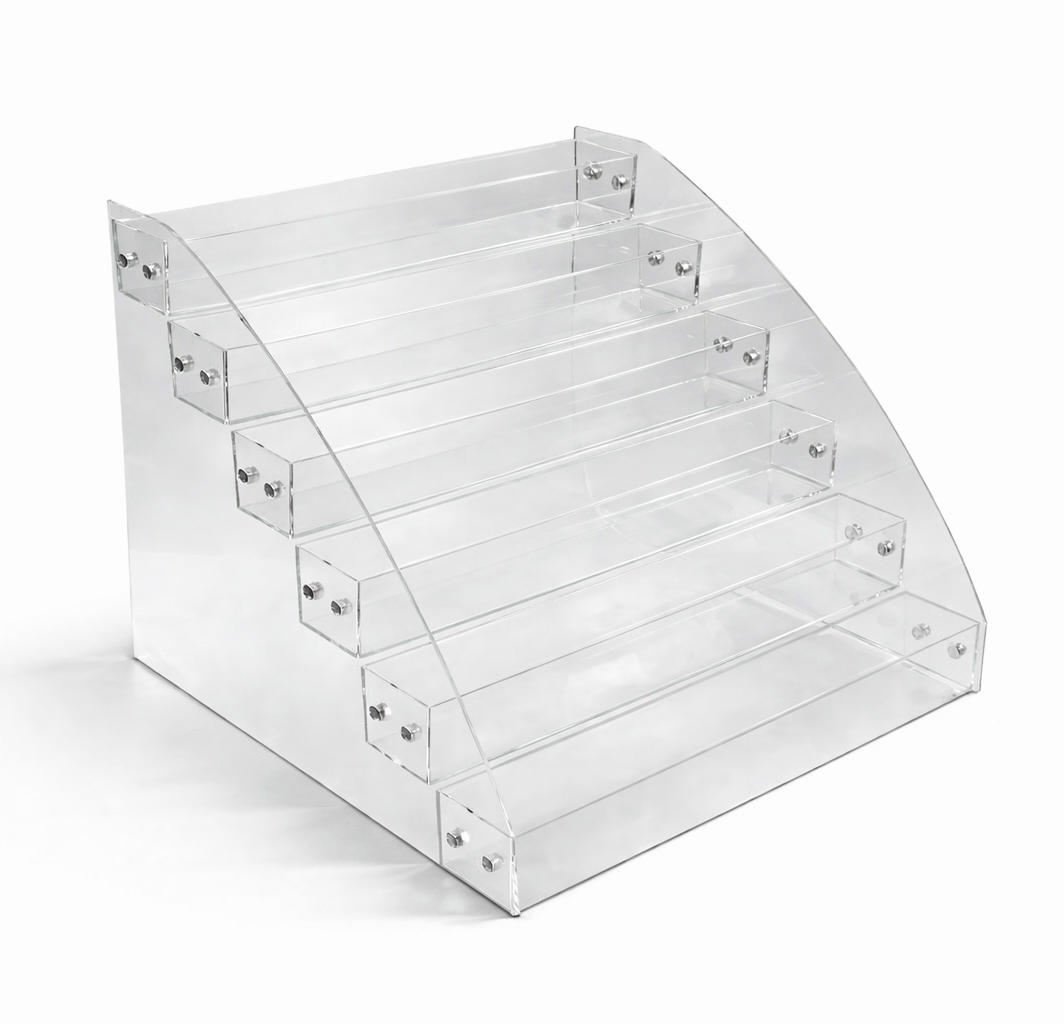 Clear acrylic tiered display on a white background