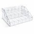 Clear acrylic display rack with multiple compartments on a white background