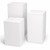 Three white cubes of different sizes on a white background