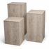 Set of three wooden cube tables on a white background