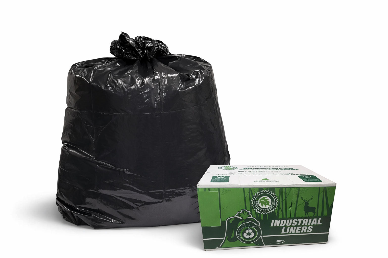 Black trash bags and a box of industrial liners on a white background