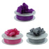 Three spools of ribbon with bows on a white background