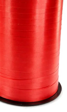 Red curling ribbon spool