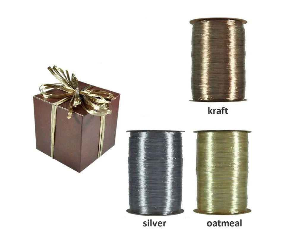 Rolls of pearlized rayon wraphia on a white background