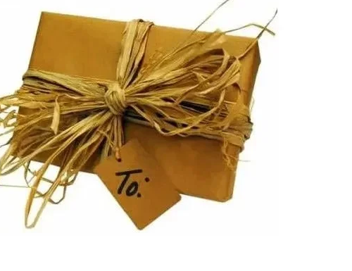 Kraft gift box tied with a natural raffia bow