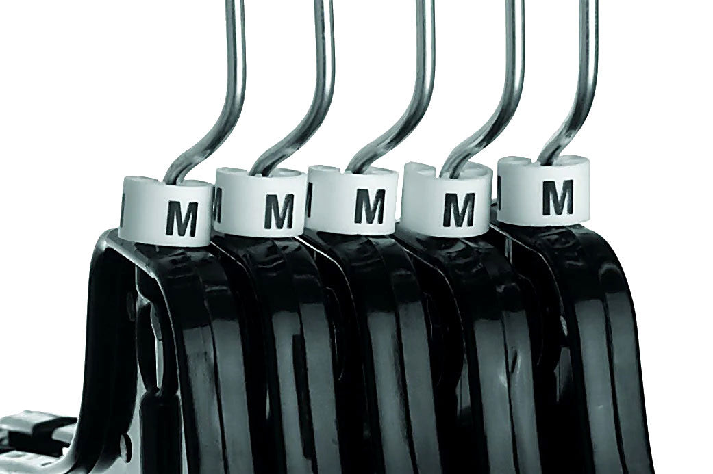 Set of black hangers with white size markers on a white background